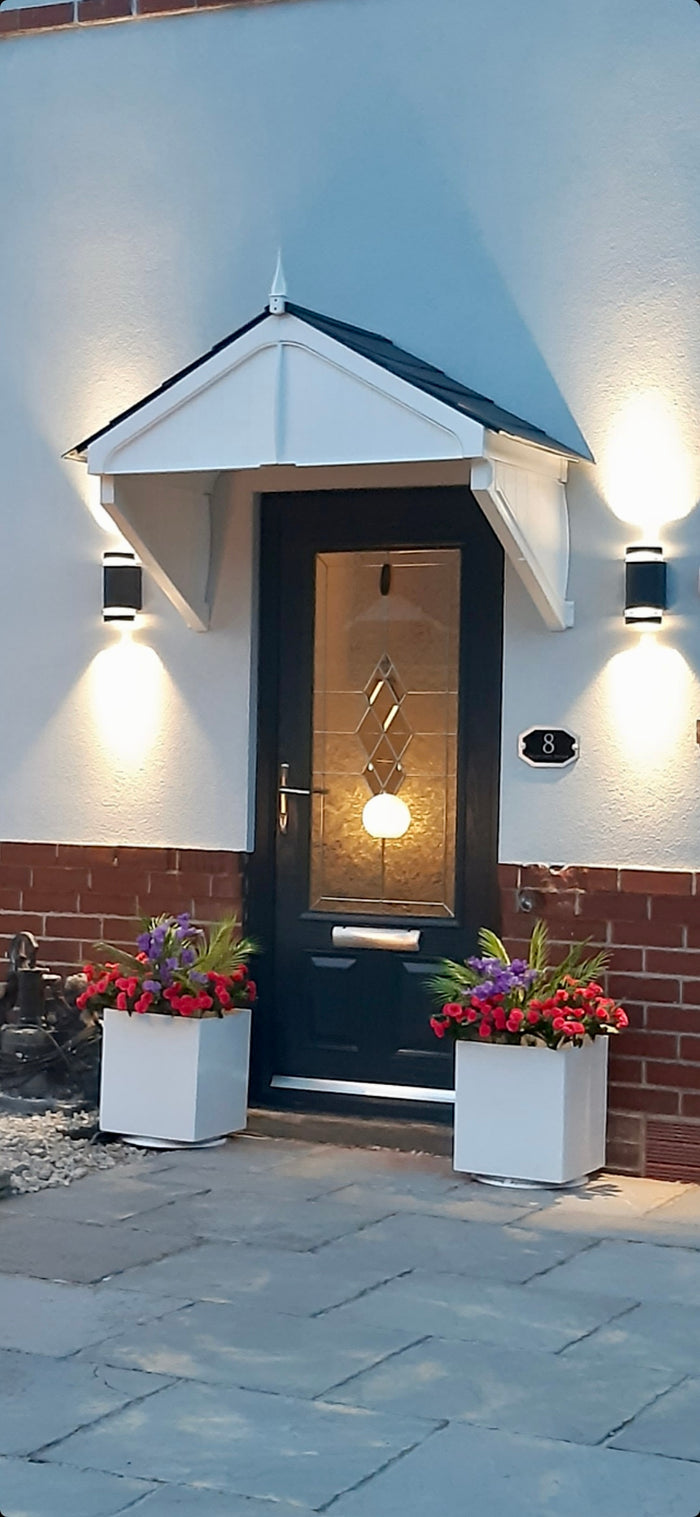 Modern flat-packed door canopy with weather-resistant roof tiles, designed for easy DIY installation above front doors and entrances.”